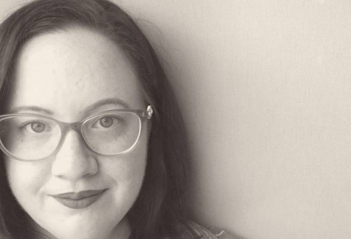 Black and white headshot of Kelly Jensen.