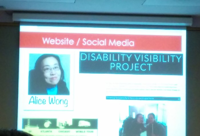 Image of a projection screen that features a screenshot of the Disability Visibility Project website. On the upper left hand corner is a photo of an Asian American woman in glasses.