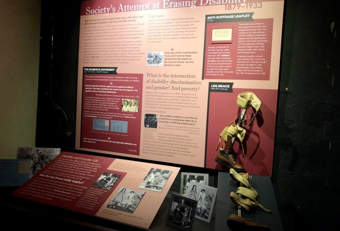 Museum exhibit on disability showing a leg brace and photos with the with the title "Society's Attempt at Erasing Disability." Photo courtesy of Gann Academy. Photo credit: Maya Wainhaus
