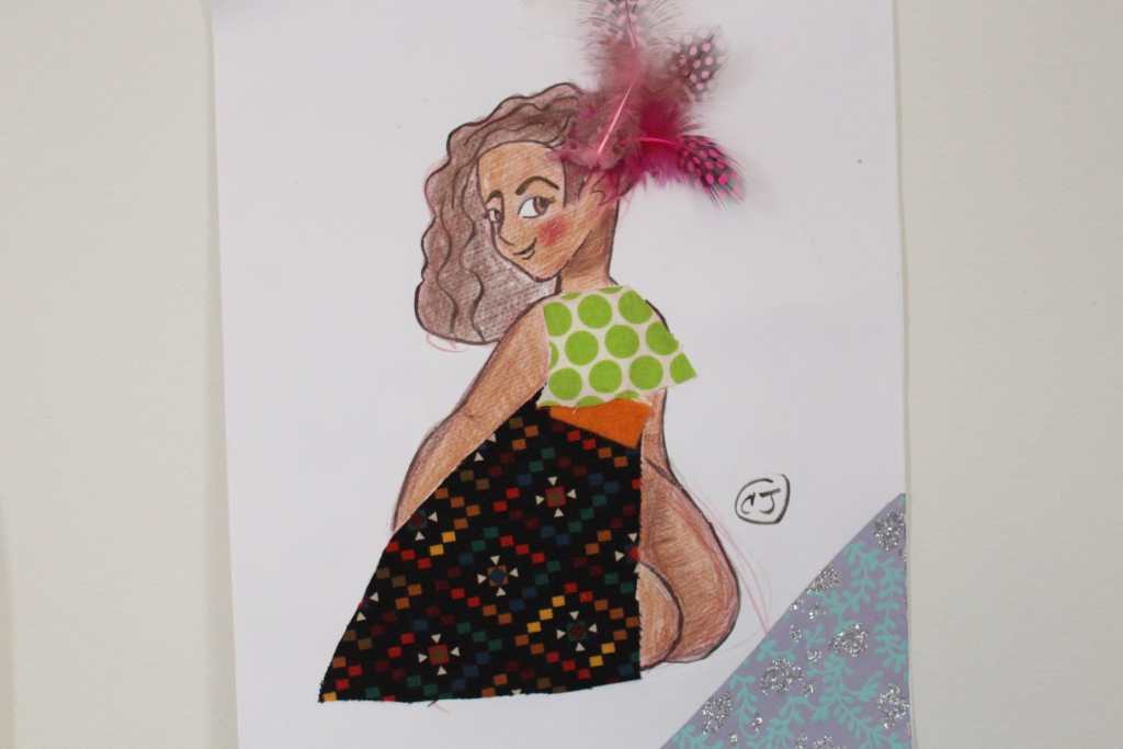 [A femme person with Brown skin and shoulder length wavy hair looks over their shoulder. Their outfit is made of different fabrics, like a green polka dot shirt, a pink feather, and black and white and red polka dotted skirt.]