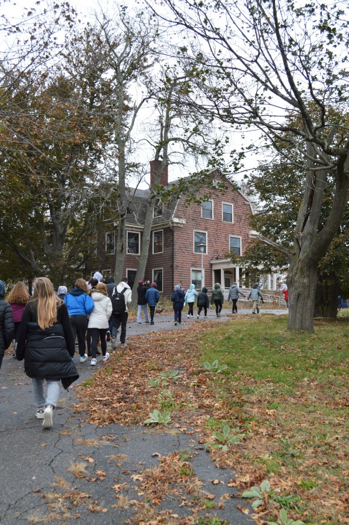 A group of students head toward the Superintendent's House, now abandoned, at the former Walter E. Fernald Developmental Center. Photo courtesy of Gann Academy. Photo credit: Maya Wainhaus