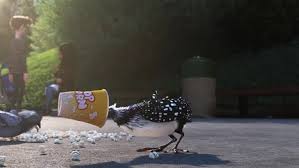 An animated scene from the Pixar film "Finding Dory." A loon with black and white feathers with her head stuck inside a popcorn container