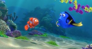 An animated scene from the Pixar film "Finding Dory." Underwater scene where a clownfish is talking to a blue tang. The blue tang looks confused.