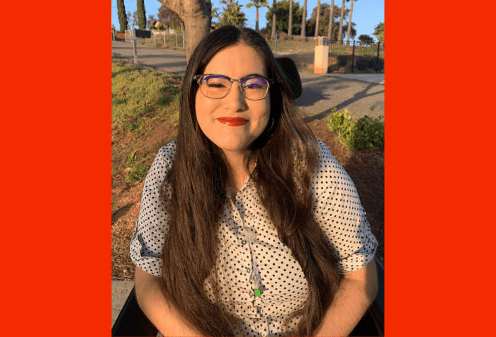 Graphic with a red background with a photo of Alena Morales, a Mexican Filipina woman, sitting in her wheelchair among San Diego palm trees. Her long brown hair is styled down around her shoulders, and she dons red lipstick with winged eyeliner. She is wearing a white button up shirt with black polka dots, and her central line hangs out from the neckline of her shirt.