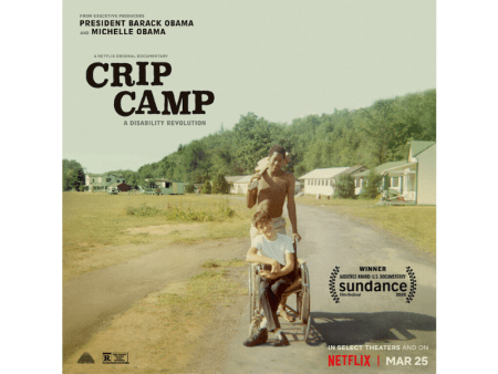 A poster for CRIP CAMP. Image is a vintage color snapshot. A person who appears to be a young white male is sitting in a manual wheelchair. A person who appears to be a black male is standing behind the wheelchair user. His left hand is holding onto the wheelchair handle. His right hand is holding a guitar slung over his shoulder. In the background are low slung bunks and buildings. Text on the poster reads (from top left to bottom right): From Executive Producers President Barack Obama and Michelle Obama. A Netflix original documentary. CRIP CAMP: A Disability Revolution. An award laurel reads: Winner Audience Award U. S. Documentary Sundance film festival 2020. On Netflix March 25.